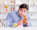 Man having dilemma between healthy food and bread in dieting con Royalty Free Stock Photo