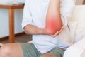 Man having elbow ache and muscle pain due to lateral epicondylitis or tennis elbow. injuries and medical concept