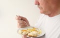 Man having fried eggs and biscuit with copy space Royalty Free Stock Photo