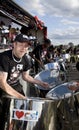 A man having fun and playing steel drums