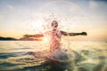 Man having fun spashing water