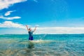 Man having fun in water on the beach Royalty Free Stock Photo