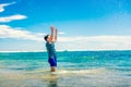 Man having fun in water on the beach Royalty Free Stock Photo