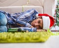 Man having hangover after christmas party Royalty Free Stock Photo