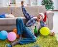 Man having hangover after christmas party Royalty Free Stock Photo