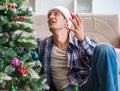 Man having hangover after christmas party Royalty Free Stock Photo