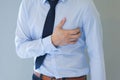 Man having heart-attack / chest pain in isolated background Royalty Free Stock Photo