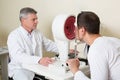 Man having his eyes examined by an eye elderly Royalty Free Stock Photo