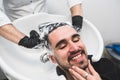 Man having his hair washed in hairdressing salon Royalty Free Stock Photo