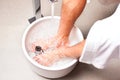 Man having hydrotherapy water footbath