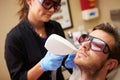 Man Having Laser Treatment At Beauty Clinic