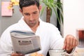 Man having a leisurely breakfast Royalty Free Stock Photo