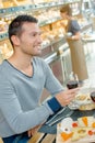 Man having meal holding glass red wine Royalty Free Stock Photo