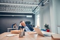 Man having migraine headache while working in the office Royalty Free Stock Photo