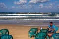 Man having Morning coffee on the beach in Tel Aviv, Israel Royalty Free Stock Photo