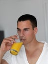 Man having orange juice Royalty Free Stock Photo