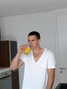 Man having orange juice Royalty Free Stock Photo