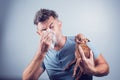 Man having pet allergy symptoms : runny nose, asthma Royalty Free Stock Photo