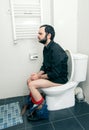 Man having problems in toilet Royalty Free Stock Photo