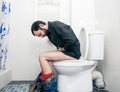 Man having problems in toilet Royalty Free Stock Photo