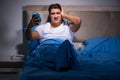 The man having trouble sleeping in bed Royalty Free Stock Photo