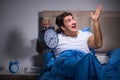 The man having trouble sleeping in bed Royalty Free Stock Photo