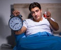 Man having trouble sleeping in bed Royalty Free Stock Photo