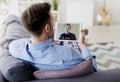 Man having a video conference with his workmate