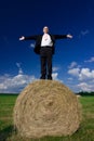 Man on hay bale Royalty Free Stock Photo