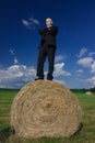 Man on Hay Bale Royalty Free Stock Photo