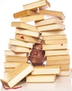Man with head between books on a white background Royalty Free Stock Photo