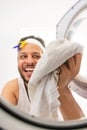 Man with headband going to wash your dirty laundry Royalty Free Stock Photo