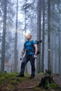 Man with headlamp and backpack in the forest Royalty Free Stock Photo