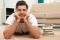 Man with headphones with book