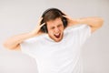 Man with headphones listening loud music Royalty Free Stock Photo