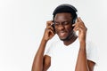 man in headphones listening to music emotions white t-shirt studio fun