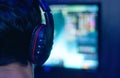 Man in headphones plays a computer game Royalty Free Stock Photo