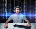 Man in headset hacking computer or programming Royalty Free Stock Photo