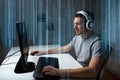 Man in headset playing computer video game at home Royalty Free Stock Photo