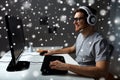 Man in headset playing computer video game at home Royalty Free Stock Photo