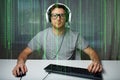 Man in headset playing computer video game at home Royalty Free Stock Photo