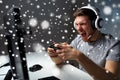 Man in headset playing computer video game at home Royalty Free Stock Photo