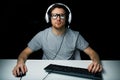 Man in headset playing computer video game Royalty Free Stock Photo