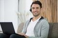 man in headset working with laptop from home Royalty Free Stock Photo