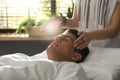 Man during healing session in room Royalty Free Stock Photo