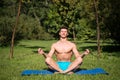 Man with healthy body meditate on yoga mat Royalty Free Stock Photo