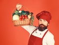 Man in healthy eating concept. Chef holds basket of vegetables Royalty Free Stock Photo