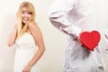 Man with heart shaped gift box for woman. Royalty Free Stock Photo