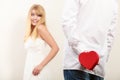 Man with heart shaped gift box for woman. Royalty Free Stock Photo