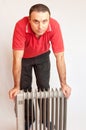 Man and heater Royalty Free Stock Photo